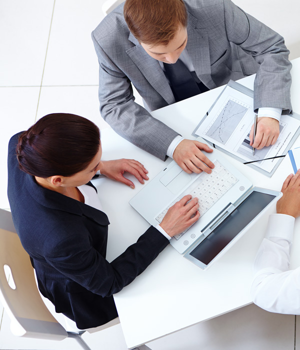 Man explaining something to his young colleague